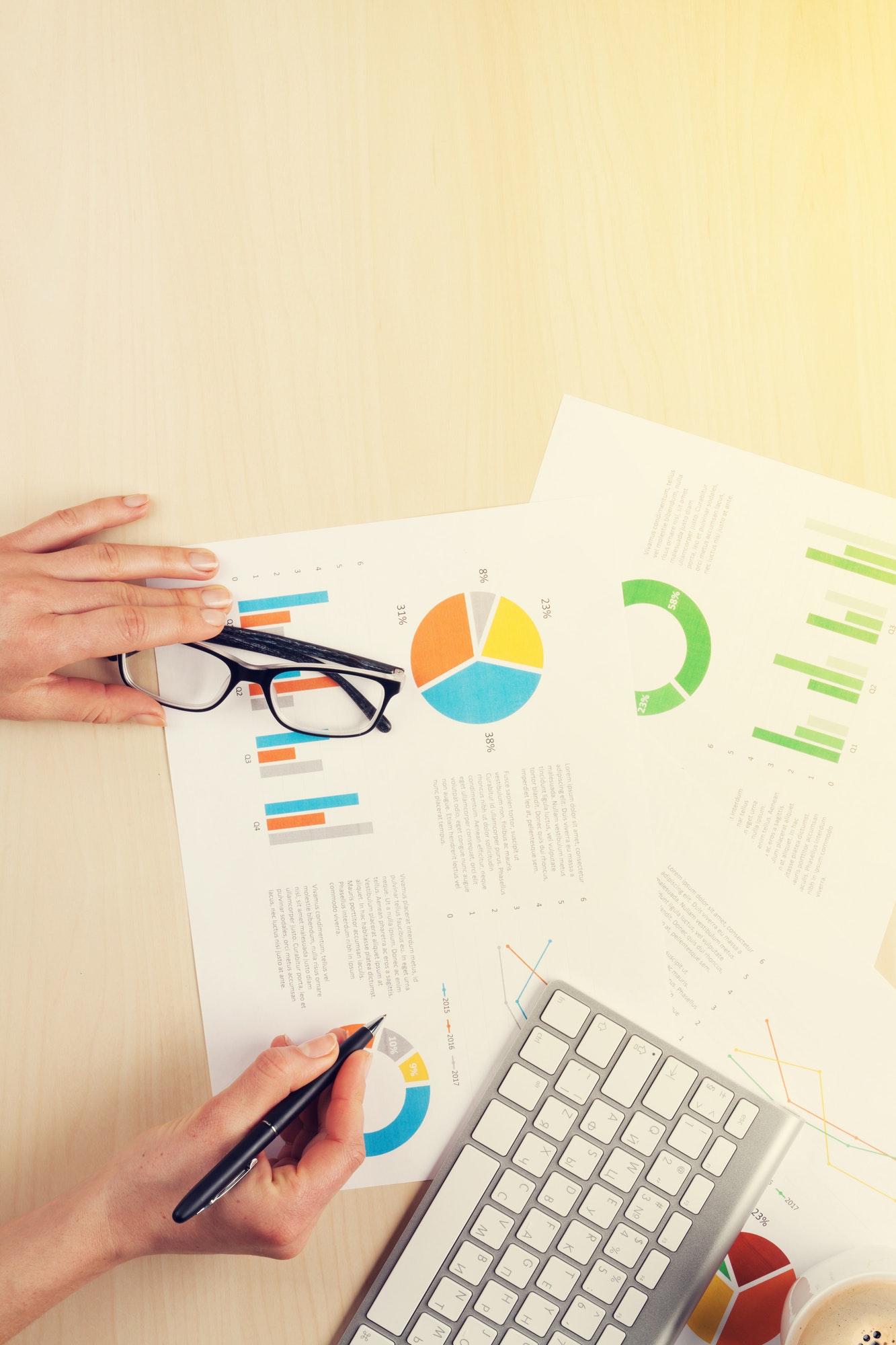 Woman working with reports and charts